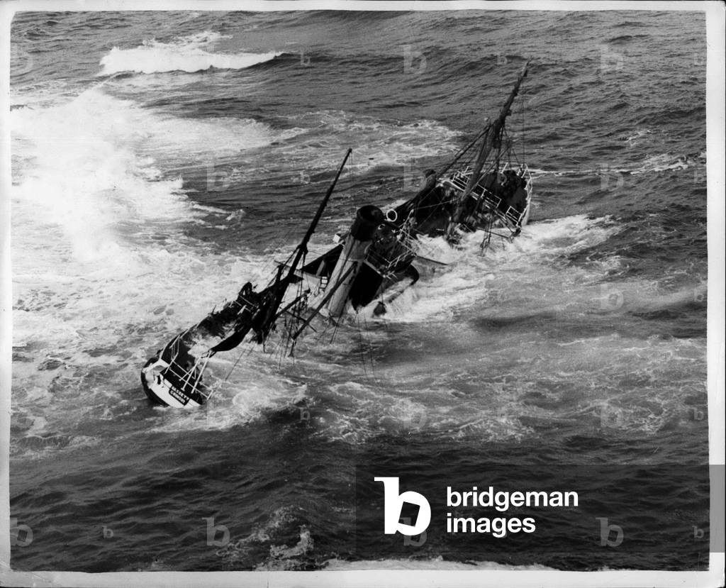 Sep. 19, 1953 - Five Men Died in Sight of Land.: Here lies the Girmaby trawler Hassett of her under water and heavy seas pounding over her Fifteen of her crew were saved yesterday, but five were drowned when their ship went aground 60 yards from shore, near Wick, Scotland.