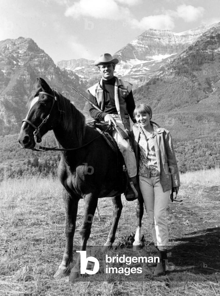 Portrait of Robert Redford riding around 1980