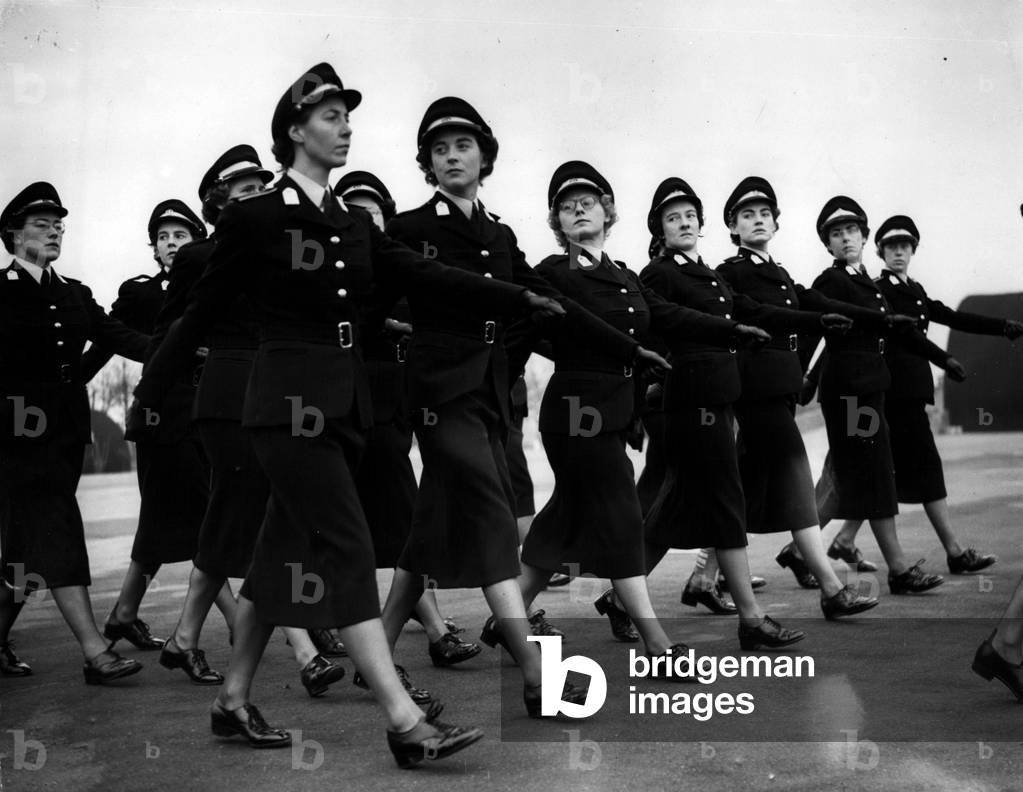 Dec. 12, 1953 - W.R.A.C. Passing Out Parade at Hindhead. March Past. Lieutenant. Gen. Sir Dudley Ward KBE Deputy Chief of the Imperial General Staff took the salute at the Passing Out Parade of W.R.A.C. Officer Cadets at the WRAC School of Instruction, Huron Camp, Hindhead, Surrey today. Keystone Photo Shows: The Passing out Squad of Officer Cadets - 'eyes right' as they march past Lieut. Gen. Sir Dudley Ward during the ceremonies at Hindhead today