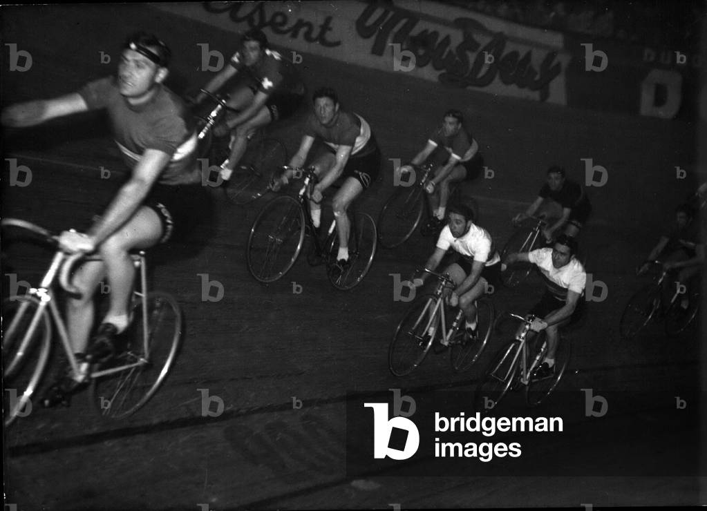 Apr. 02, 1954 - Paris Six day race started last night: The competitors of the six day cycling race snapped soon after the Race started last night. At right (White Sweaters) the two Italian cyclists Piazza and Rossi. They are surrounded by the Swiss Roth Schulte and Godeau and Ockers (Belg