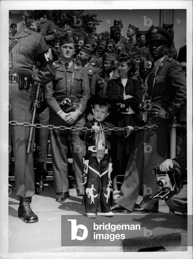 May 17, 1953 - Army Day in Nuremberg, Germany: All outfits assigned and/or attached to Nuremberg Military Post yesterday celebrated Army Day: The Commanding General Nuremberg Military Post inspect the parade, Photo shows Probably the nicest shot ever take-during the parade at the occasion of the Army Day celebrated in Nurember, Germany. A nice US gentleman seen looking at the men parading in front of him.