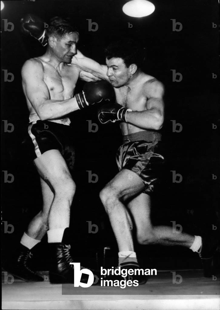 Tue 22, 1953 - Cliff Curvis Versus Gilbert Lavoine In Paris: Lavoine Hits With An Uppercut. Cliff Curvis Lost The Match And The Title After The Referee Stopped The Fight At The 10th Round.