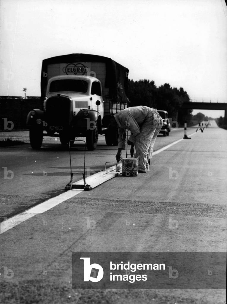 Sep. 09, 1953 - Painters repaint white lines between Hamburg and Bremen Germany