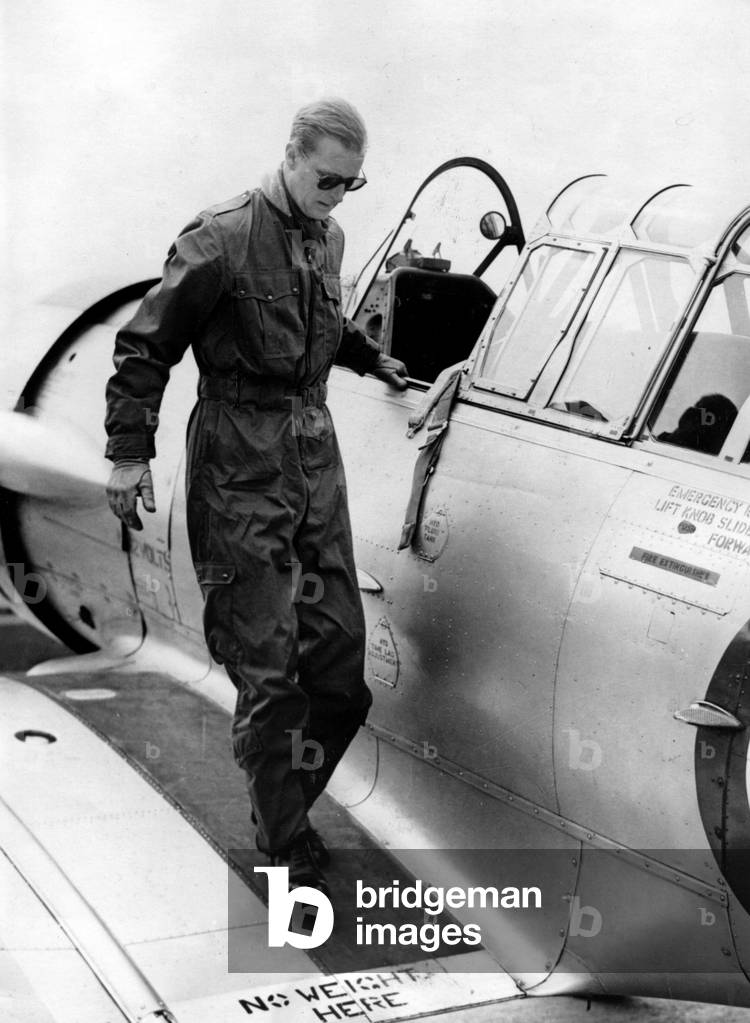 May 4, 1953 - White Waltham, Berkshire, U.K. - PRINCE PHILIP (Philip Mountbatten) leaving a Harvard Trainer one seater after a flight.